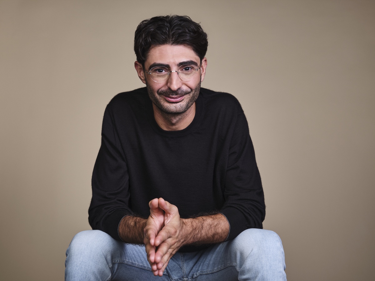 Lee Hnetinka, Founder, CEO & CTO of FutureAI, seated studio portrait 2026