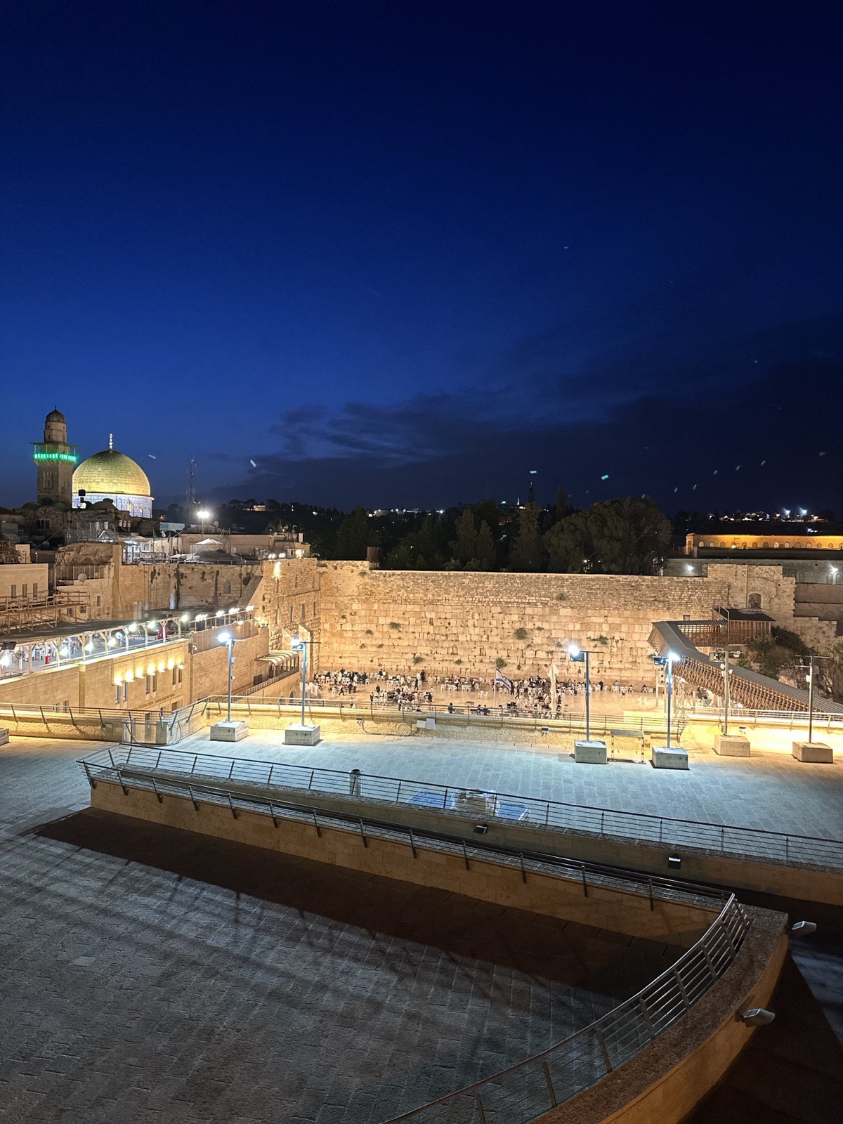 The Western Wall (the Kotel) lit at night in the Old City of Jerusalem, photographed by Lee Hnetinka