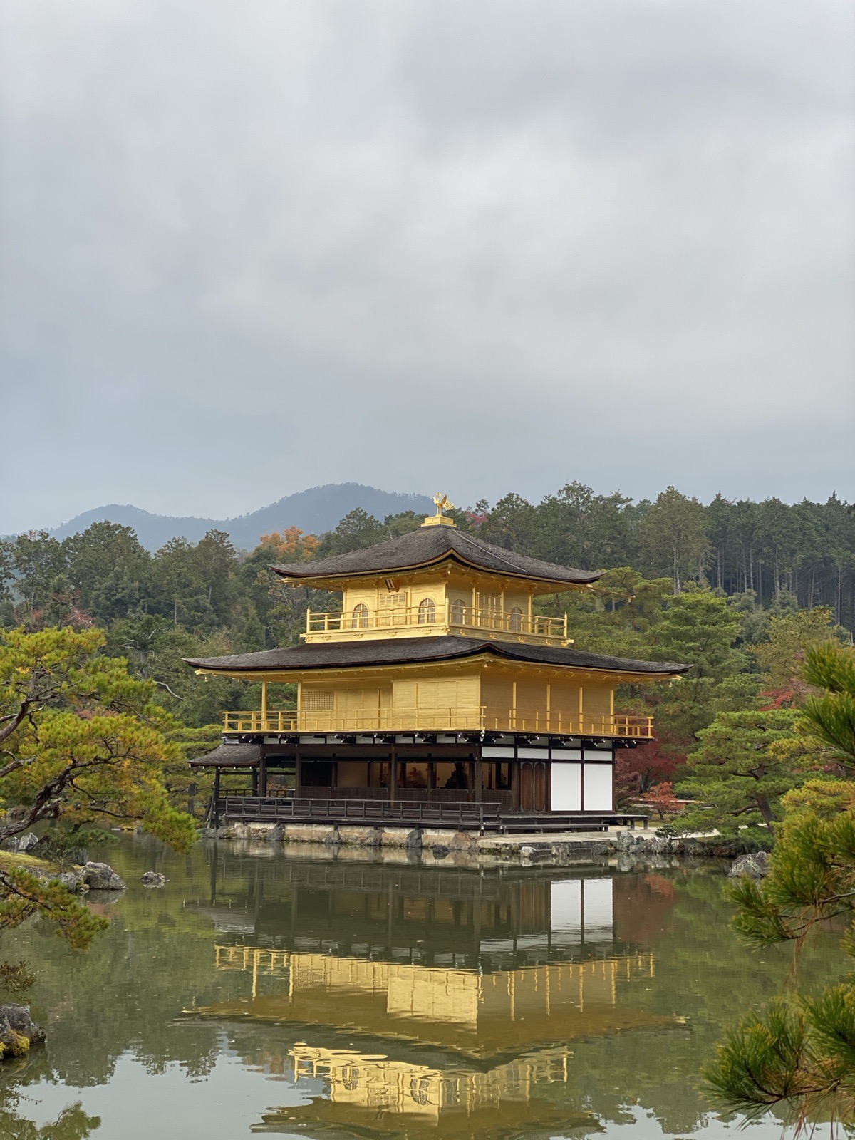 Kinkaku-ji, the Golden Pavilion (Golden Temple), mirrored in its pond in Kyoto, Japan, photographed by Lee Hnetinka