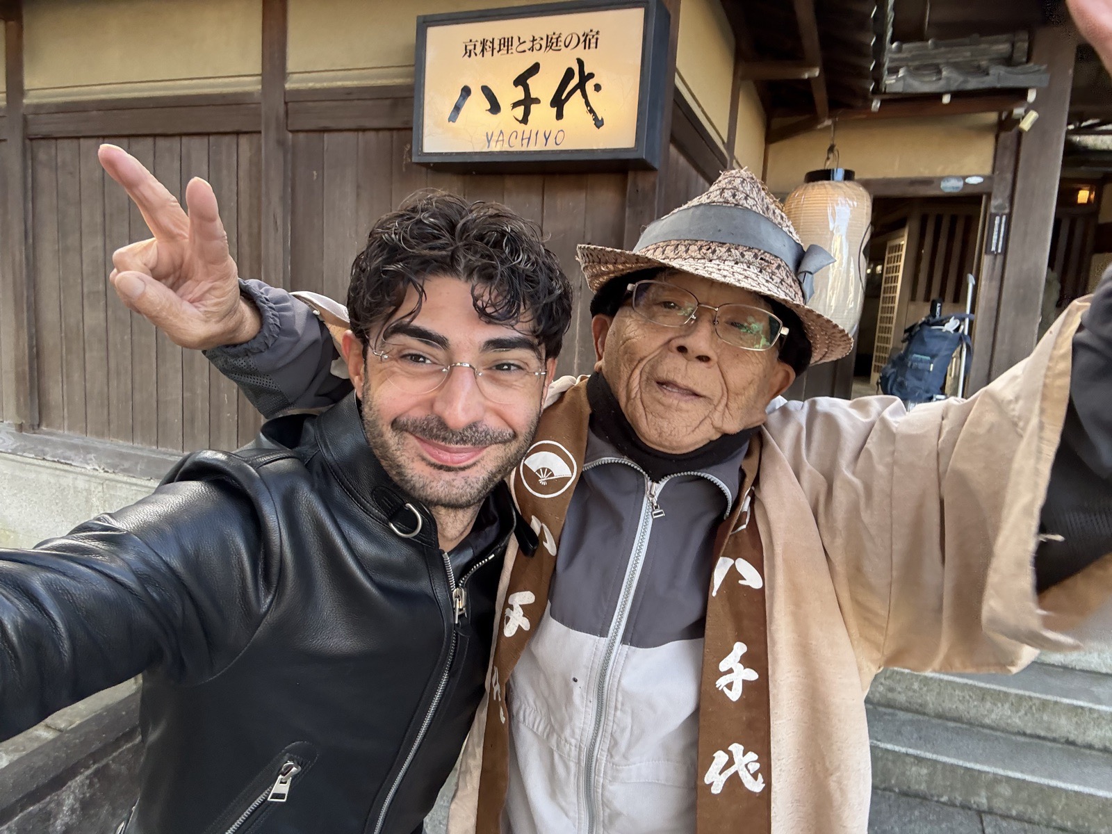 Lee Hnetinka with a host outside the Yachiyo inn in Kyoto, Japan, 2024