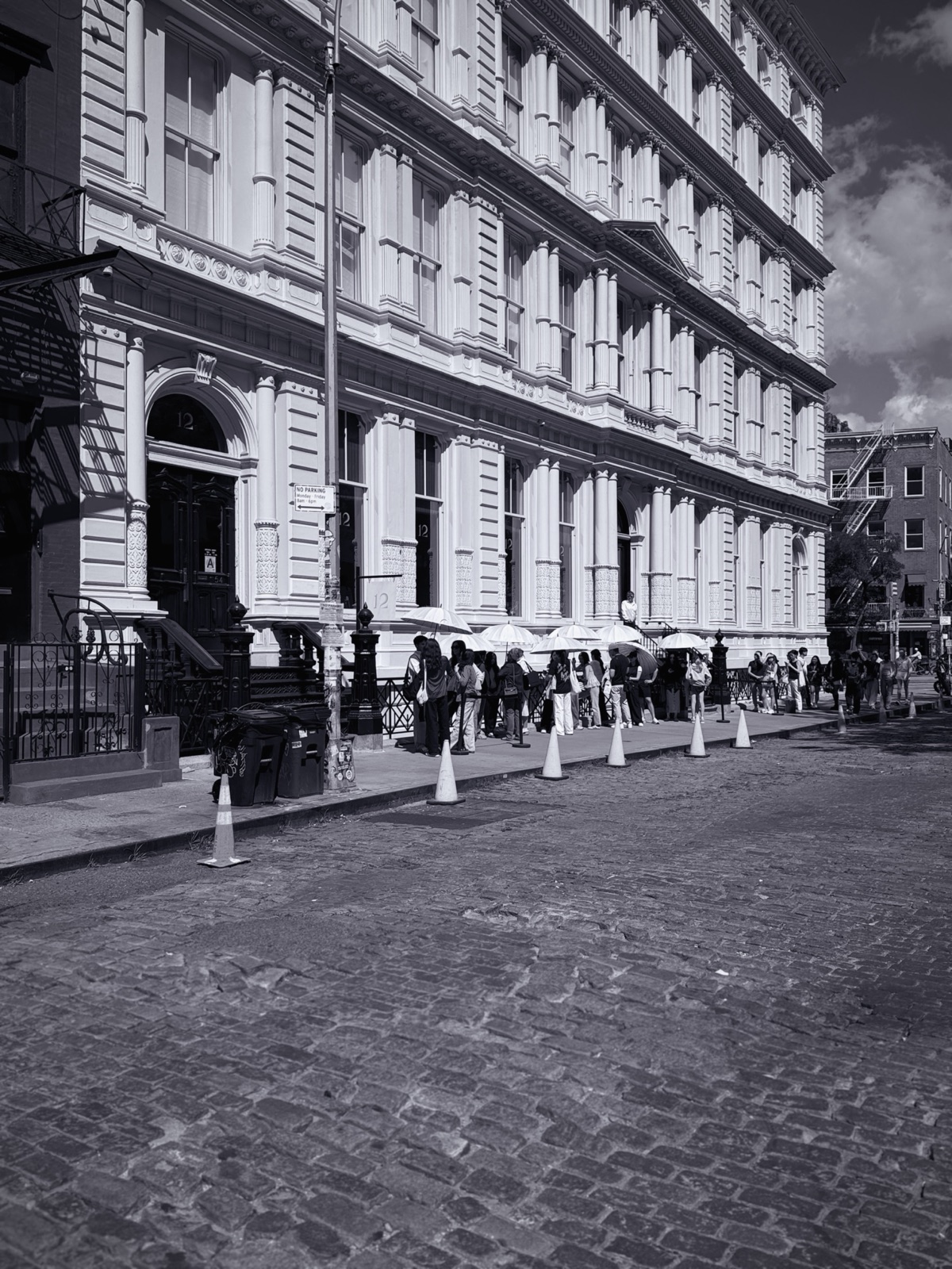 A New York City street and facade in black and white, photographed by Lee Hnetinka