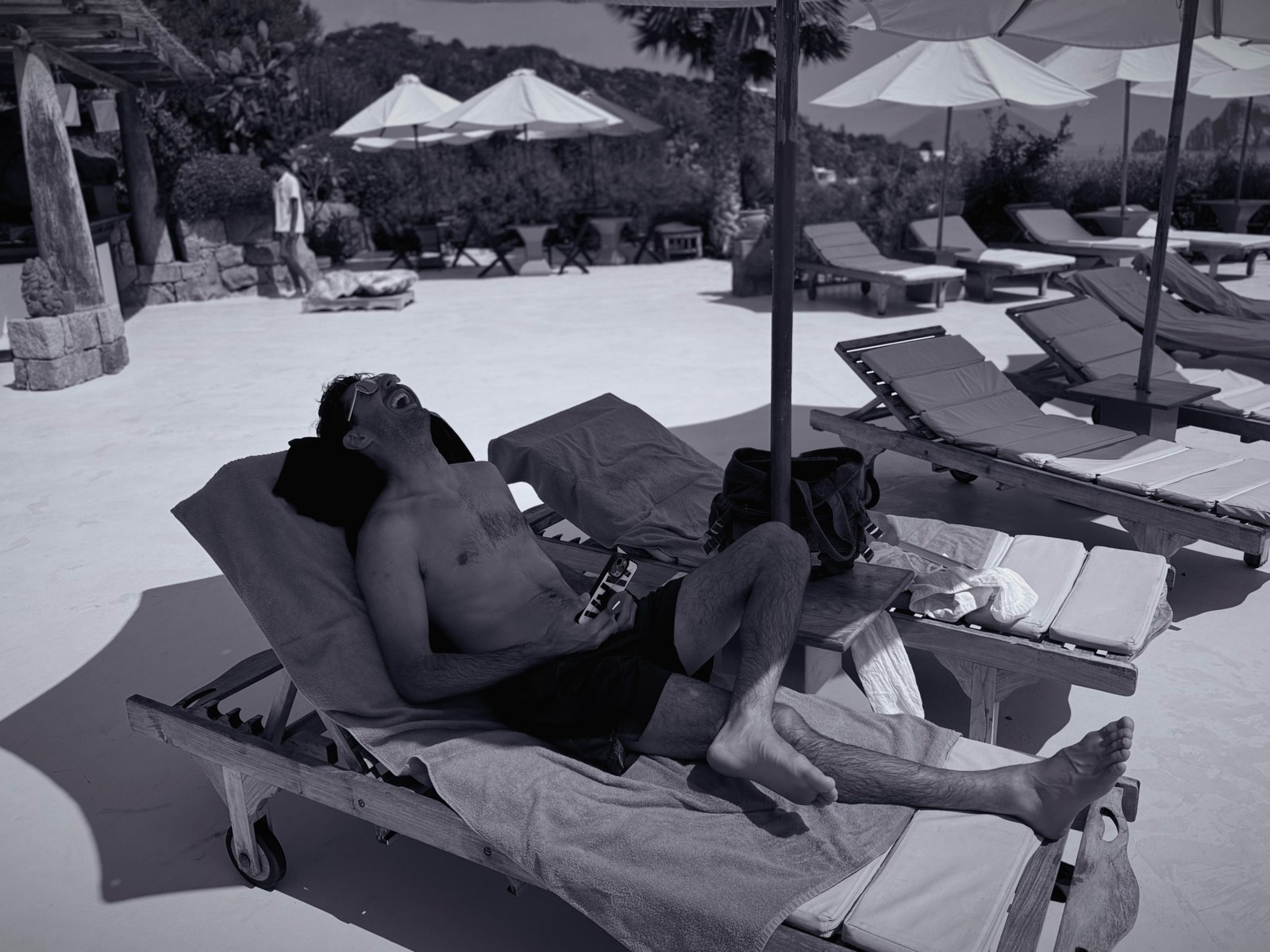 Lee Hnetinka at a poolside beach club in Panarea, Italy