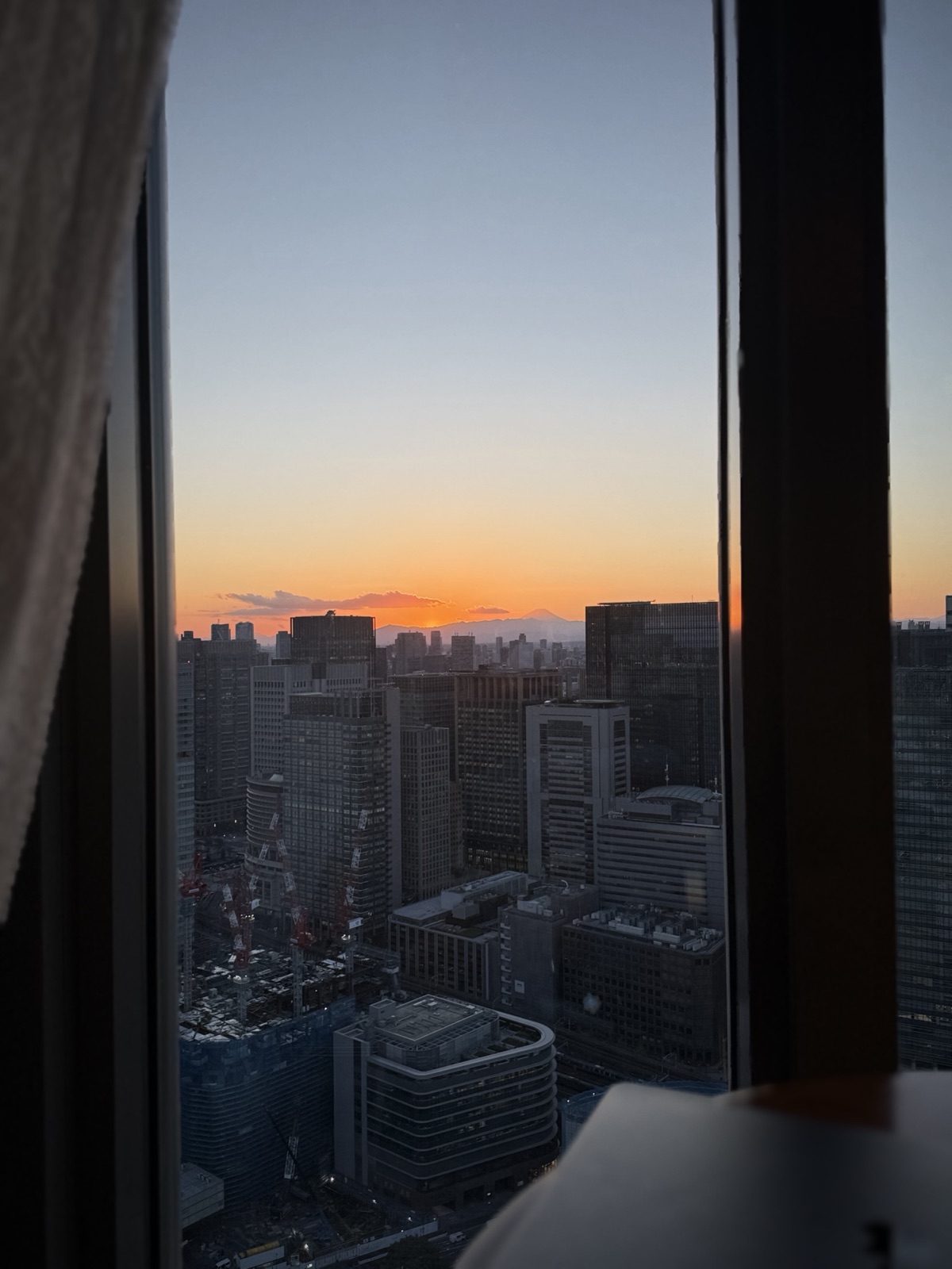 The Tokyo skyline with Mount Fuji at sunset, Japan, photographed by Lee Hnetinka
